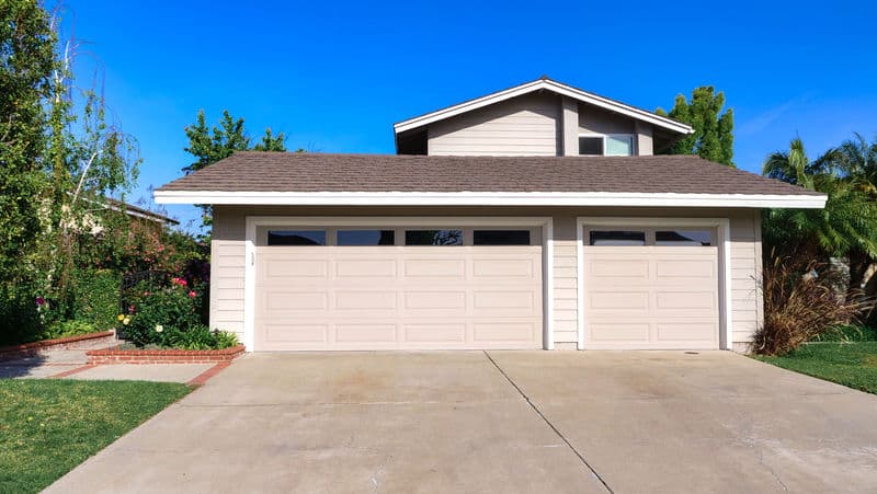 Residential driveway restoration after pressure washing